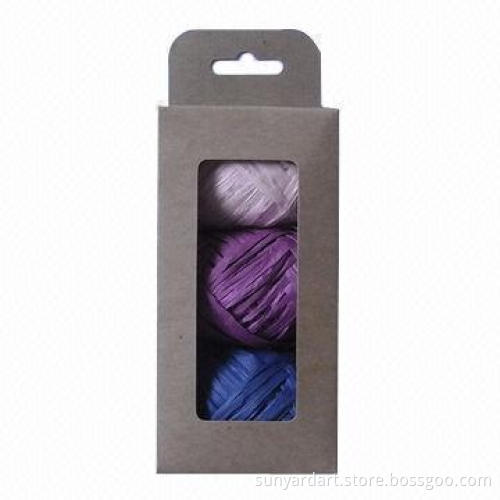 Paper raffia ribbon egg in Kraft paper window box